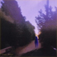 an image of a person walking down a road